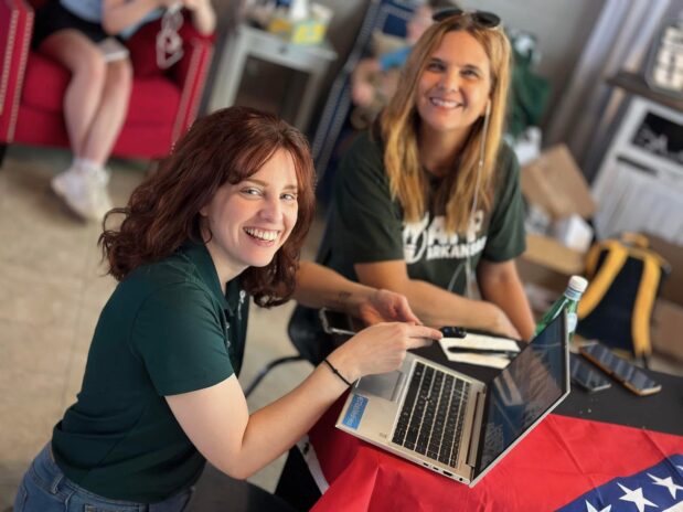 two americans for prosperity members participating in an outreach event